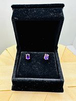 Pair of oval amethyst 10k gold stud earrings in black velour box