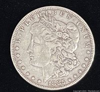 Obverse of the 1885 Morgan Silver Dollar showing Lady Liberty and date 1885 with no mint mark.