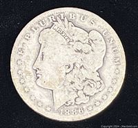 Obverse side of the 1886-O Morgan Silver Dollar showing Liberty head and year 1886.