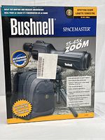 Box front of Bushnell Spacemaster 15-45x60mm spotting scope showing main features and included accessories.