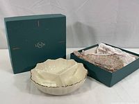 Lennox green box containing the white china three-compartment dish with scalloped edges and gold rim, alongside colorful packing material.