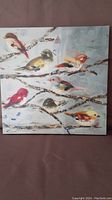 Full view of square canvas painting showing multiple colorful birds on branches