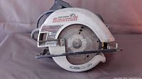 Side view photo of Craftsman 7 1/4 inch circular saw showing the blade, base plate, and housing including label with model details.