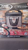 Photo of the Power Pressure Cooker XL packaged box showing product image and features including 7.5 liter capacity and various cooking functions.