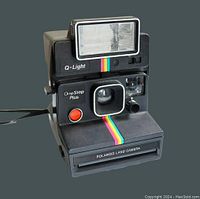 Front view of the Polaroid Land Camera One Step Plus with Q-Light detachable flash, showing camera lens, red shutter button, flash, and rainbow stripe down front.