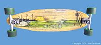 Top view of vintage bamboo skateboard deck showing sunset and landscape graphic and Sector 9 logo.