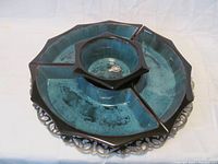 Top view showing entire four-piece sectional server in blue-green glaze with brown trim