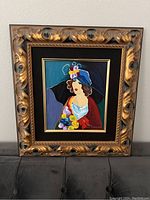 Framed serigraph ‘Debbie’ by Itzchak Tarkay, showing full front view of artwork.