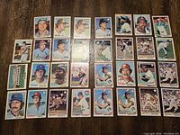 Full spread of all 31 baseball cards arranged on table, showing front side with player images and team logos.