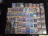 Overview showing 58 cards featuring Gary Carter in various baseball poses and team uniforms laid out on a surface.
