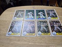 Eight Kirk Gibson rookie baseball cards laid out on table, six Fleer and two Donruss cards, showing front sides with mostly batting and outfield images.