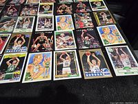 Photo showing multiple Larry Bird basketball cards in various action and portrait shots.