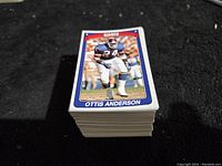 Stack of football cards showing the top card featuring Ottis Anderson of the Giants.