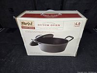Image of the sealed original box showing Parini branding and size information for the 4.0 quart Dutch oven.