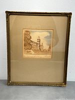 Full view of framed etching showing the artwork, frame and protective glass