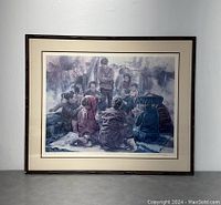 Full view of the framed art print showing group scene and black frame