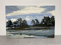 Front view of entire painting showing rocky shoreline, pine trees and cloudy sky