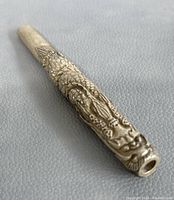 Full view of the silver plated holder showing length and dragon design