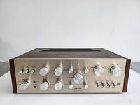 Front panel view showing control knobs, switches, headphone jack and power LED