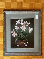 Full front view of framed floral print showing detailed flowers and ornate frame.