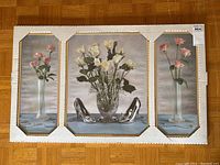 Full view of the triple mirror set in original packaging showing central and side panels with floral paintings and decorative elements.