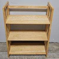 Front view of the 3-shelf foldable wood bookcase showing three rectangular shelves and side frame with vertical slats