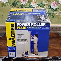 Wagner Power Roller Plus electric paint roller system in original box with images and text explaining features