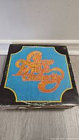Chicago Transit Authority album cover with worn black border and colorful orange text on blue background.