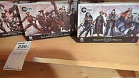 Overview of three sealed Steamforged Games expansion boxes: The Scarlet Circus, The Instruments of War, Shadow of the Tyrant