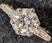 Top view showing round center stone and tapered baguette shoulders