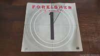 Front of vinyl record sleeve with Foreigner Urgent design