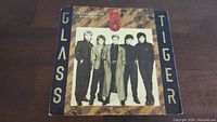 Front of Glass Tiger Don't Forget Me 45rpm single sleeve with band photo and title.