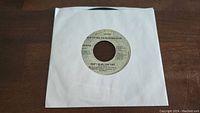 7-inch vinyl record single titled "Don't Do Me Like That" by Tom Petty and the Heartbreakers with Asylum Records label, in a white paper sleeve.
