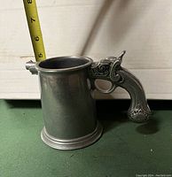 Side view of Wilton Armetale pewter beer mug showing pistol handle and size.