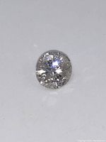Front view of loose round brilliant cut diamond showing table facets