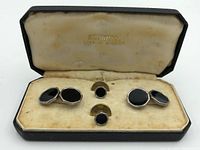 Regnum cufflink set displayed inside original box showing two cufflinks and two studs on velvet insert with interior box marking.