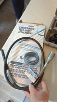 Dremel Flex-Shaft attachment in original packaging showing flexible shaft and connectors
