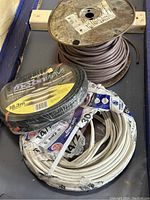 Photo of all three cable rolls together on a flat surface.