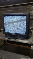 Samsung CRT television showing static on screen, front view