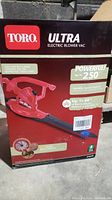 Original product packaging box showing Toro Ultra Electric Blower Vac branding, product image, and specifications such as up to 250 MPH power and variable speed control.