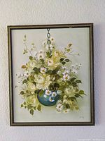 Frontal image of the framed floral painting showing bouquet of white roses and daisies in a hanging blue pot.