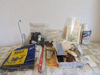Wide view of all sewing notions including kits, yarn, needles, measuring tape and attachments
