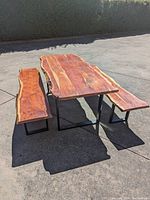 Front view of table and two benches arranged outdoors
