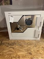 Front view of Hollon combination safe on plywood shelf