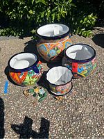 All four planters and turtle figurine grouped outdoors