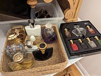 Basket with mixed perfume bottles and mini perfume gift set