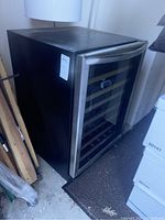Angled full view of wine cooler showing exterior finish and door handle