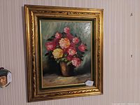 Full front view of the oil painting and gilt frame hanging on wall