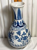 Full view of the blue and white ceramic vase showing shape and pattern