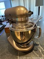 Front angle of mixer with bowl and pour shield installed